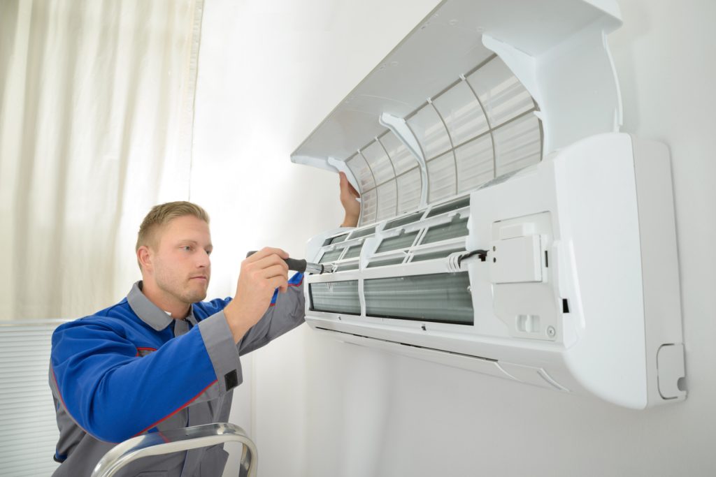 Man Repairing Air Conditioner